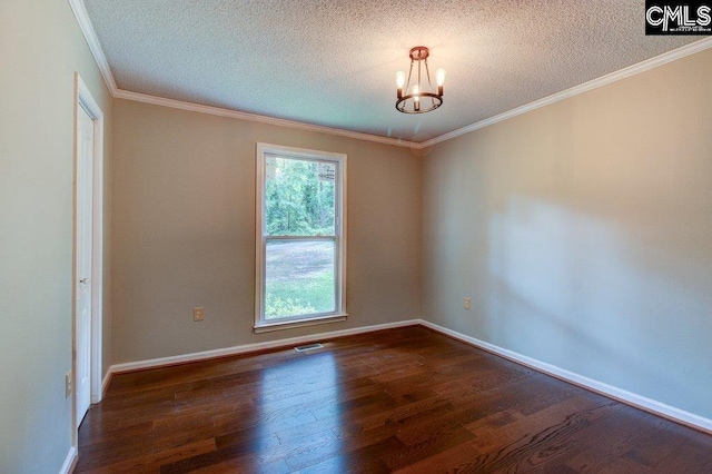 7905 Castleton Ln, Columbia, SC 29223 - spare room with plenty of natural light, a chandelier, dark wood-style flooring, a textured ceiling, and ornamental molding