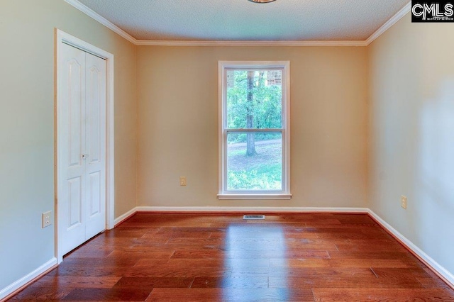 7905 Castleton Ln, Columbia, SC 29223 - empty room featuring wood finished floors, ornamental molding, baseboards, and a textured ceiling