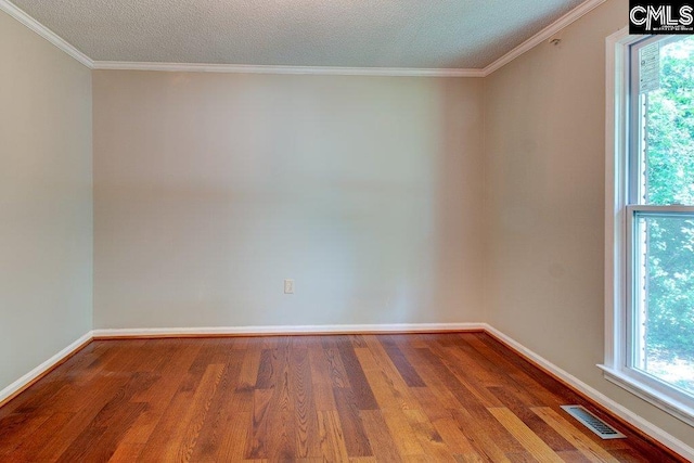 7905 Castleton Ln, Columbia, SC 29223 - unfurnished room with wood finished floors, healthy amount of natural light, baseboards, crown molding, and a textured ceiling