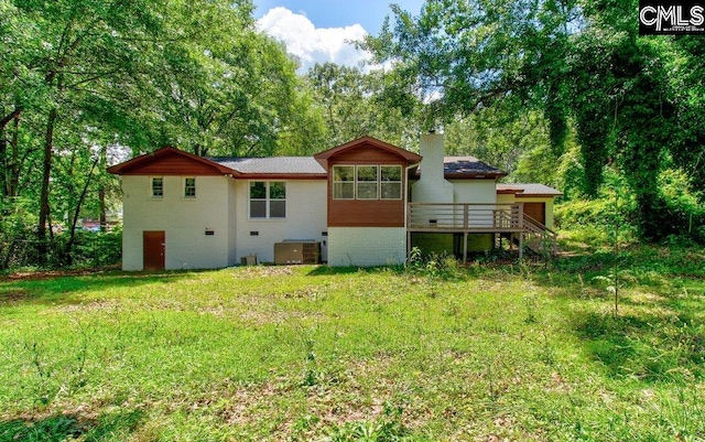 7905 Castleton Ln, Columbia, SC 29223 - rear view of property featuring a chimney, central AC, a wooden deck, and stairs