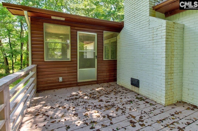 7905 Castleton Ln, Columbia, SC 29223 - property entrance with a wooden deck and brick siding
