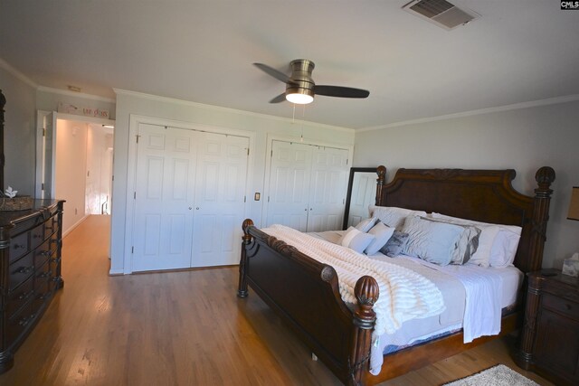 2 Indian Creek Trl, Lexington, SC 29072 - bedroom with wood finished floors, two closets, crown molding, and ceiling fan