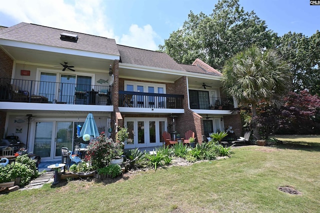 2 Indian Creek Trl, Lexington, SC 29072 - back of property with ceiling fan, a balcony, brick siding, a lawn, and a shingled roof