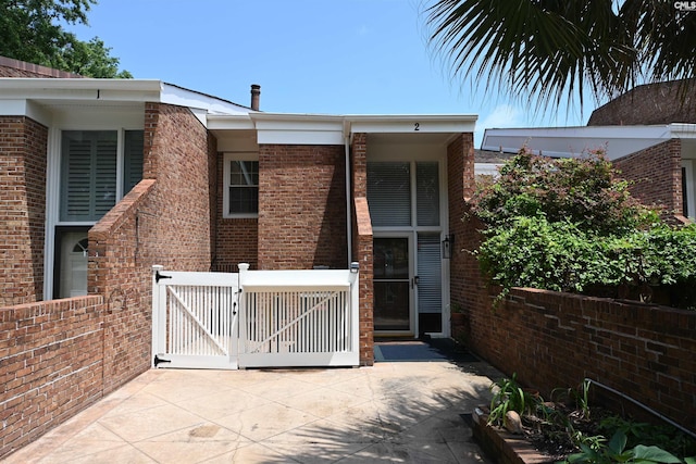 2 Indian Creek Trl, Lexington, SC 29072 - view of property exterior featuring a gate and brick siding