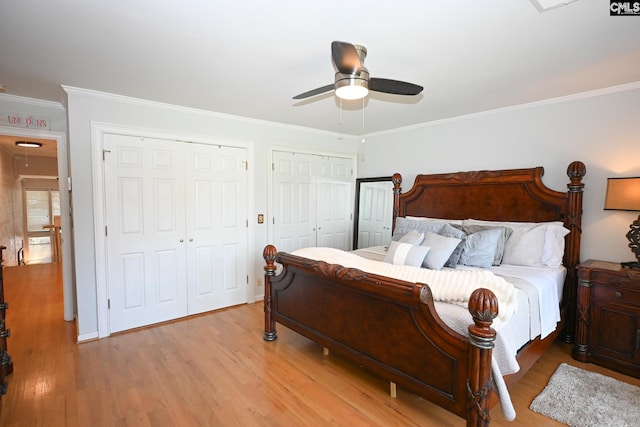 2 Indian Creek Trl, Lexington, SC 29072 - bedroom with multiple closets, light wood-style floors, ornamental molding, and ceiling fan