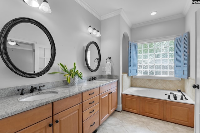 full bathroom featuring ornamental molding, tile patterned floors, double vanity, and a garden tub