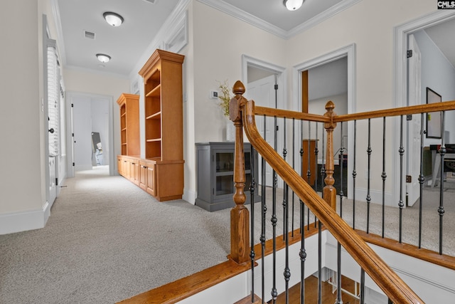 hall featuring ornamental molding, carpet floors, and baseboards