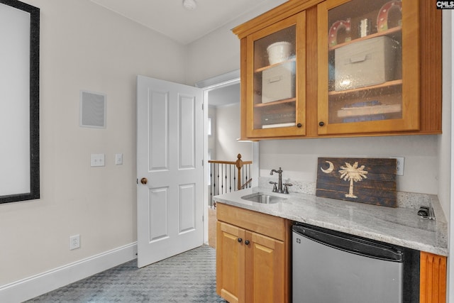 bar area with refrigerator, a sink, baseboards, and light colored carpet