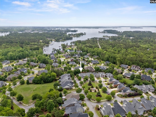 aerial view of residential area featuring a nearby body of water