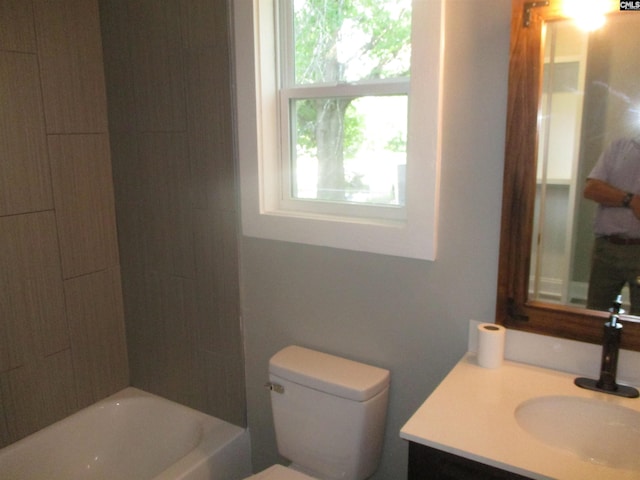 full bath featuring toilet, vanity, and shower / bath combination