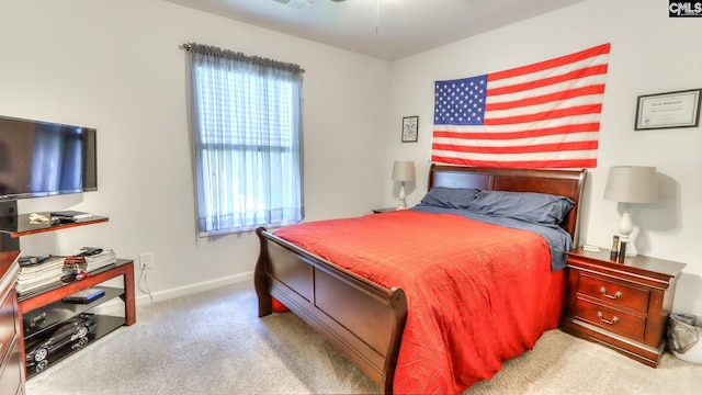 bedroom featuring carpet floors and baseboards