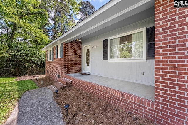 4306 Windemere Ave, Columbia, SC 29203 - property entrance with brick siding, crawl space, and fence
