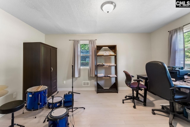 4306 Windemere Ave, Columbia, SC 29203 - office with a textured ceiling, light wood-type flooring, and baseboards