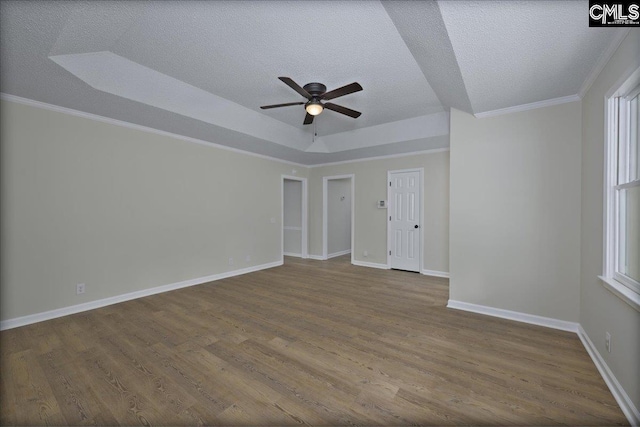 1045 Manchester Cir, Sumter, SC 29154 - empty room with ceiling fan, dark wood finished floors, a textured ceiling, ornamental molding, and baseboards