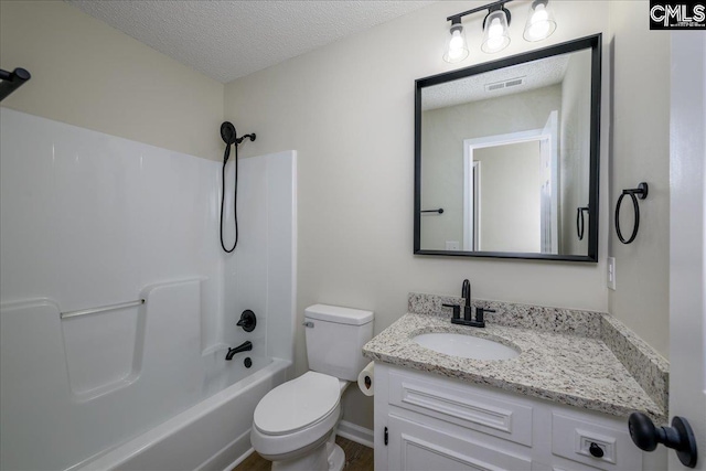 1045 Manchester Cir, Sumter, SC 29154 - bathroom featuring a textured ceiling, toilet, vanity, and  shower combination