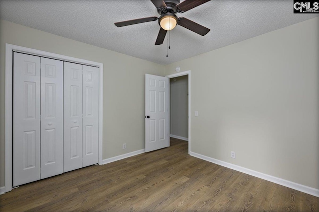 1045 Manchester Cir, Sumter, SC 29154 - unfurnished bedroom featuring wood finished floors, baseboards, a closet, a textured ceiling, and a ceiling fan
