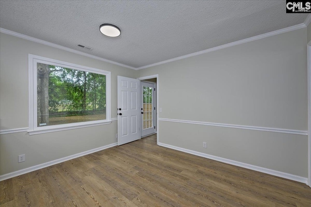 1045 Manchester Cir, Sumter, SC 29154 - foyer with wood finished floors, a textured ceiling, baseboards, and ornamental molding