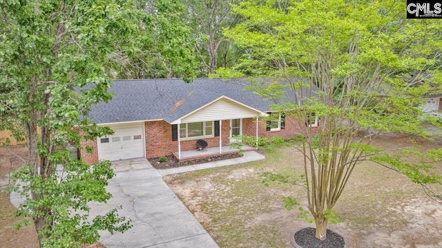 1045 Manchester Cir, Sumter, SC 29154 - ranch-style home with a garage, brick siding, driveway, and a shingled roof