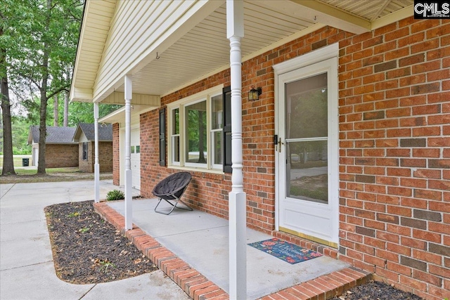 1045 Manchester Cir, Sumter, SC 29154 - view of exterior entry with a porch and brick siding