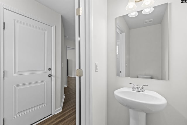2794 Prince Charles Ct, Columbia, SC 29209 - bathroom featuring a sink, wood finished floors, and baseboards