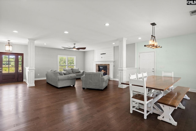1307 Dusty Rd, Cope, SC 29038 - dining space with decorative columns, recessed lighting, dark wood-type flooring, ceiling fan, and a brick fireplace