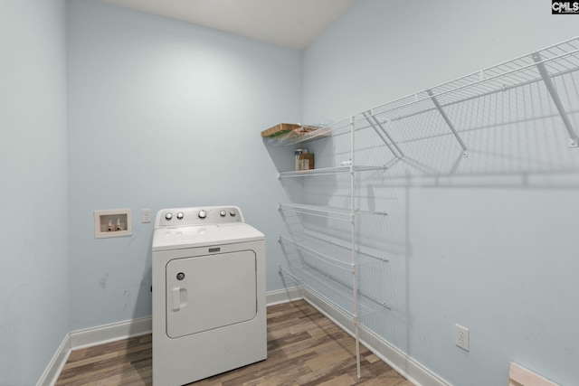 1307 Dusty Rd, Cope, SC 29038 - clothes washing area with washer / dryer, wood finished floors, and baseboards
