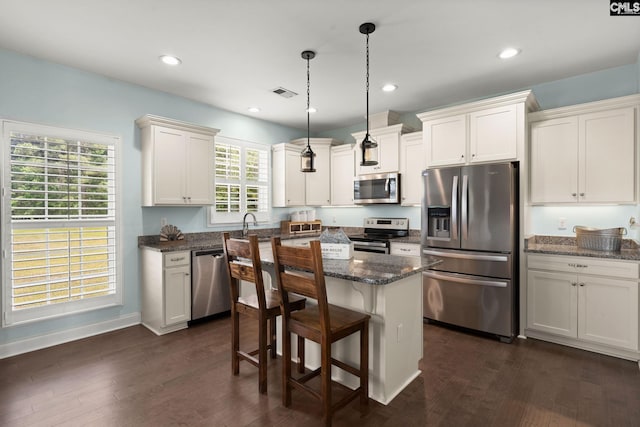 1307 Dusty Rd, Cope, SC 29038 - kitchen featuring stainless steel appliances, dark wood finished floors, a kitchen breakfast bar, pendant lighting, and recessed lighting