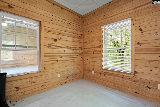 1307 Dusty Rd, Cope, SC 29038 - spare room with wood walls and unfinished concrete floors