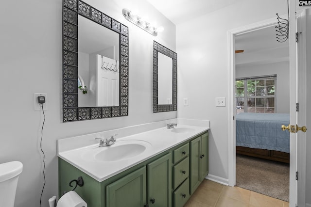 311 Coventry Lake Dr, Lexington, SC 29072 - ensuite bathroom featuring tile patterned floors, double vanity, toilet, and baseboards