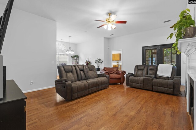 311 Coventry Lake Dr, Lexington, SC 29072 - living area featuring a ceiling fan, wood finished floors, a chandelier, and baseboards