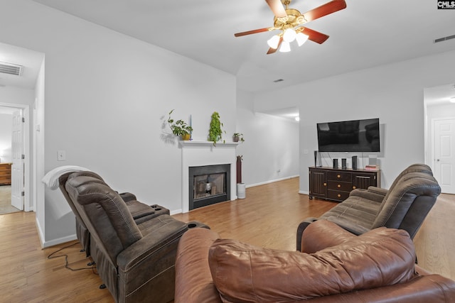 311 Coventry Lake Dr, Lexington, SC 29072 - living room featuring a ceiling fan, wood finished floors, a fireplace, and baseboards