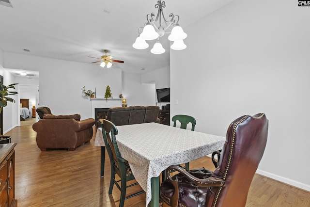 311 Coventry Lake Dr, Lexington, SC 29072 - dining area featuring wood finished floors, ceiling fan, a chandelier, and baseboards