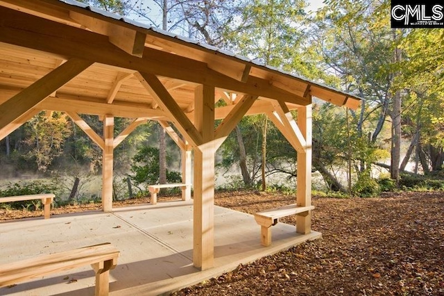 surrounding community with a gazebo and a patio area