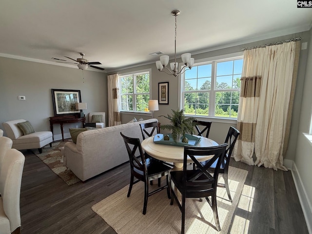 dining space with dark wood-style floors, a chandelier, baseboards, and a ceiling fan