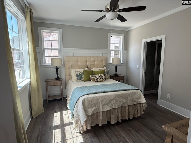 bedroom featuring dark wood-type flooring, multiple windows, baseboards, and ceiling fan
