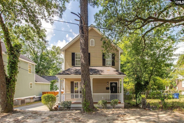 1029 Maxcy St, Columbia, SC 29201 - view of front facade with a porch, fence, and a shingled roof