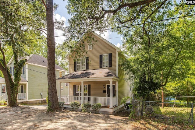 1029 Maxcy St, Columbia, SC 29201 - view of front of house featuring a porch, fence, crawl space, and a shingled roof