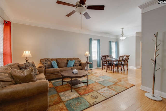 1029 Maxcy St, Columbia, SC 29201 - living room with ceiling fan, crown molding, baseboards, and light wood-style flooring
