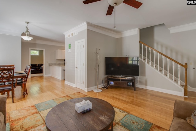 1029 Maxcy St, Columbia, SC 29201 - living room with ceiling fan, light wood-style flooring, ornamental molding, stairs, and baseboards