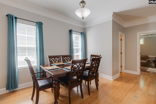 1029 Maxcy St, Columbia, SC 29201 - dining room with light wood-type flooring, crown molding, and baseboards