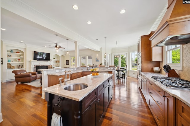 3011 River Vista Way, Mount Pleasant, SC 29466 - kitchen featuring a sink, a spacious island, stainless steel gas cooktop, open floor plan, and recessed lighting