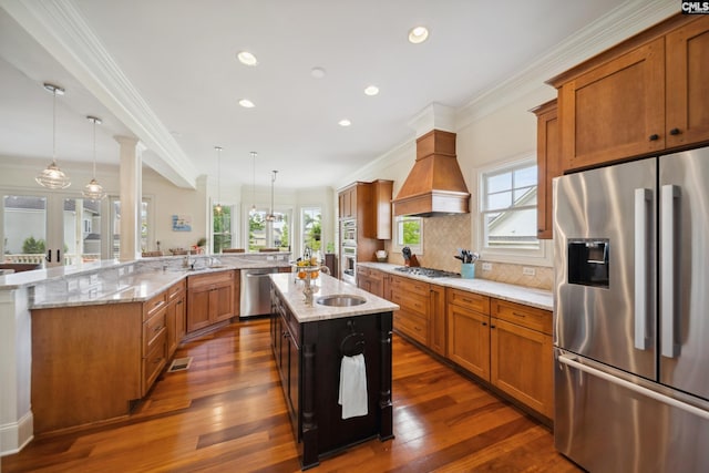 3011 River Vista Way, Mount Pleasant, SC 29466 - kitchen featuring stainless steel appliances, a large island, crown molding, decorative backsplash, and dark wood-type flooring