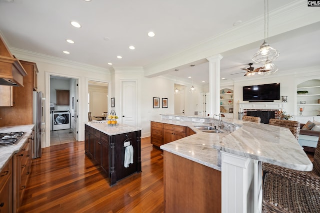 3011 River Vista Way, Mount Pleasant, SC 29466 - kitchen featuring washer / dryer, a spacious island, appliances with stainless steel finishes, ceiling fan, and a sink