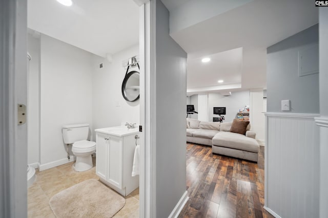 3011 River Vista Way, Mount Pleasant, SC 29466 - bathroom with toilet, ensuite bathroom, vanity, recessed lighting, and hardwood / wood-style flooring