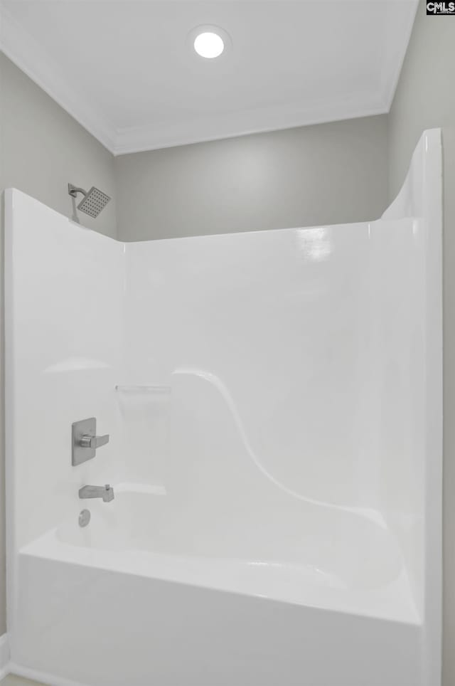 bathroom featuring ornamental molding and shower / bathtub combination