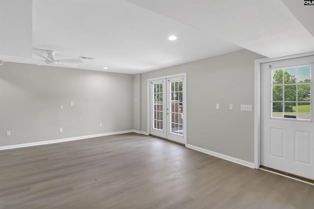 unfurnished room with french doors, baseboards, wood finished floors, recessed lighting, and a ceiling fan