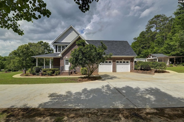 view of front facade with an attached garage, brick siding, driveway, and a front yard