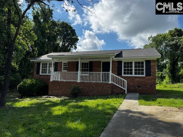241 Savannah Dr, Columbia, SC 29203 - view of front of house with a porch, a front yard, brick siding, and crawl space