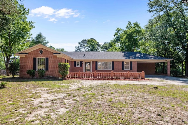 3040 Barnes Springs Rd, Columbia, SC 29204 - single story home with driveway, brick siding, and an attached carport