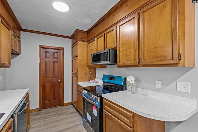 3040 Barnes Springs Rd, Columbia, SC 29204 - kitchen featuring appliances with stainless steel finishes, light wood-type flooring, crown molding, light countertops, and brown cabinets